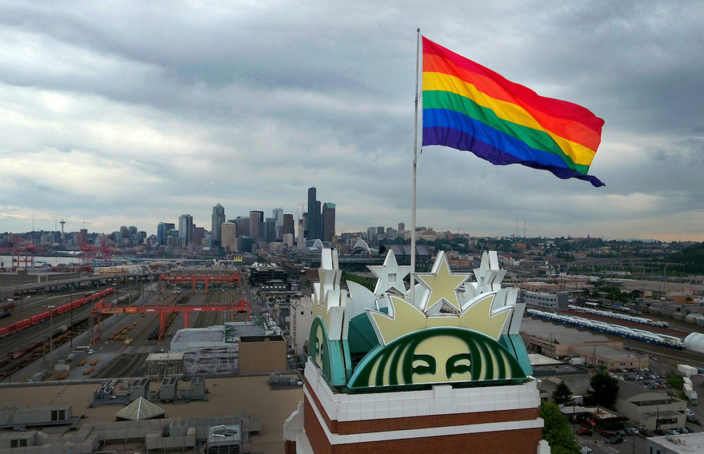 The Pride flag is raised over the Starbucks Support Center for the third year in Seattle on June 20, 2016.