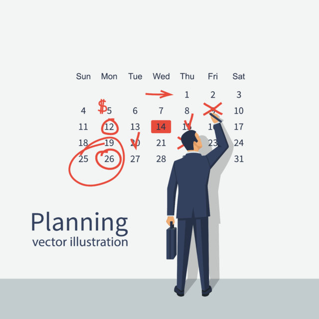 Mark calendar. Businessman makes notes on calendar