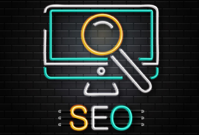 Vector isolated neon sign of computer and magnifier glass for decoration on the wall background. Concept of Search Engine Optimization.