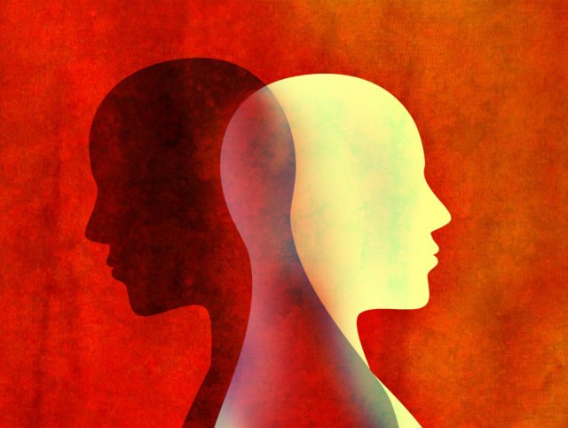 Bipolar disorder mind mental concept. Change of mood. Emotions. Dual personality. Split personality. Head silhouette of man