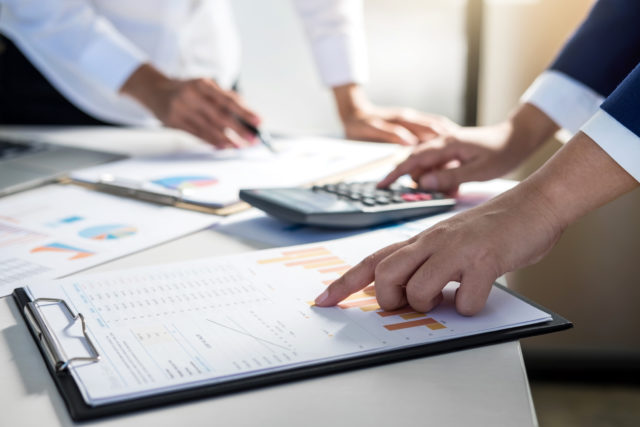 Teamwork of business colleagues consultation market growth on financial document graph report, professional occupation working analyzing startup and investment project to development grow to success