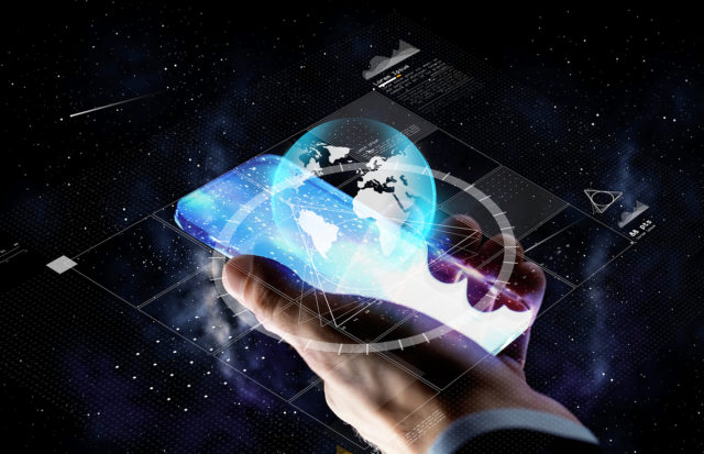 hand with smartphone and earth projection